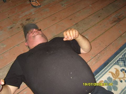 1989 Ford Bronco - Man lying on a wooden deck with a rug in the background. Date stamp shows 19/07/2008.