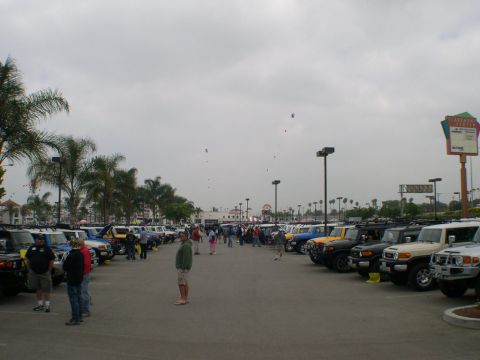 2007 Toyota FJ Cruiser - A gathering of Toyota FJ Cruisers in a parking lot under an overcast sky.