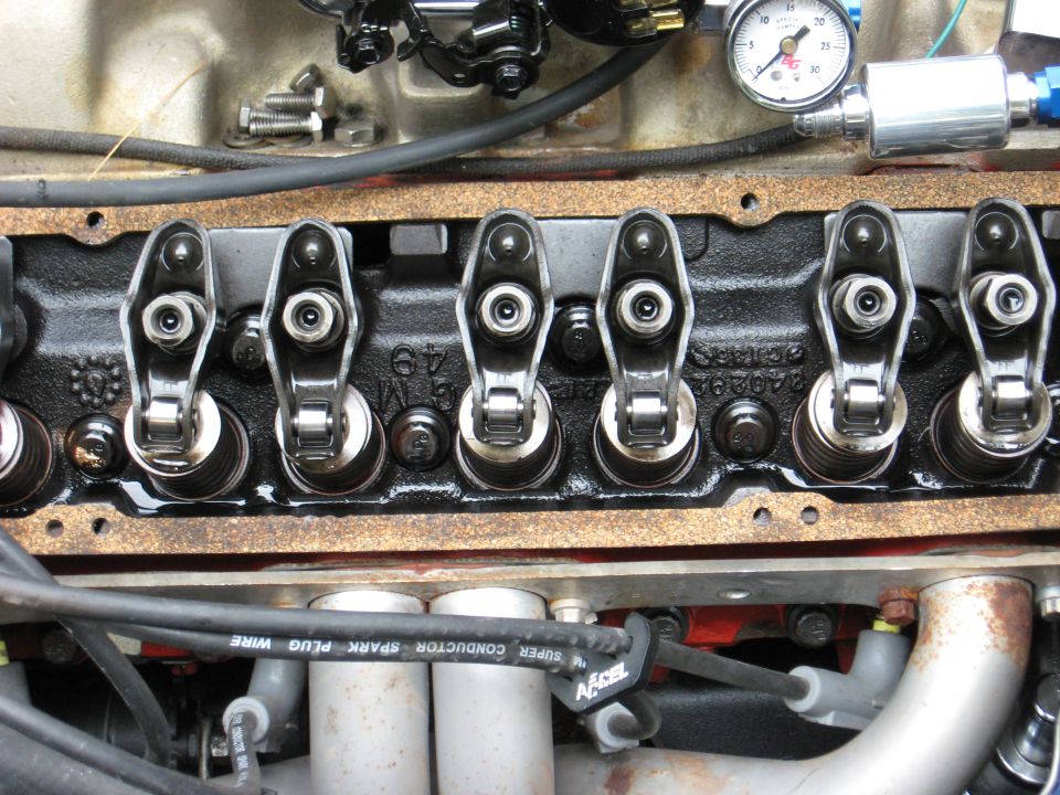 Close-up of an engine's valve train with rocker arms and springs visible