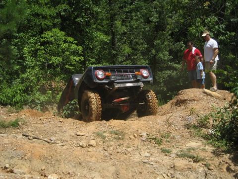 1995 Ford Bronco - This classic Ford Bronco is navigating a challenging off-road trail.