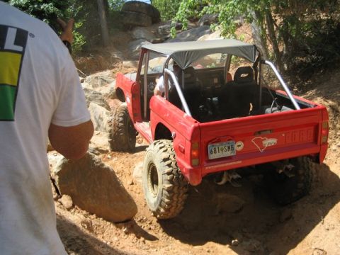 1995 Ford Bronco - Red Ford Bronco navigates a challenging rocky off-road course in July 2008.