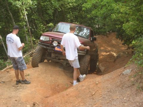 1995 Ford Bronco - Off-roading in the woods with a modified SUV.