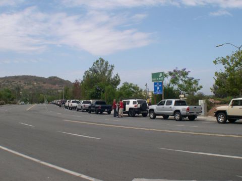 2007 Toyota FJ Cruiser - Several Toyota FJ Cruisers and Tacomas are lined up on the side of the road near a Park & Ride sign.
