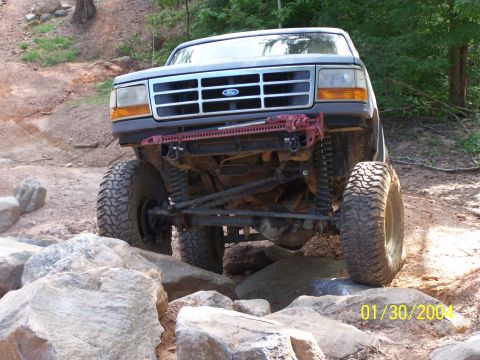 1979 Ford F-150 - Modified Ford F-Series truck tackling a rocky off-road trail.
