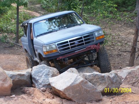 1979 Ford F-150 - A gray pickup truck is shown off-roading over a rocky terrain, with a date stamp of 01/30/2004 visible in the lower right corner.