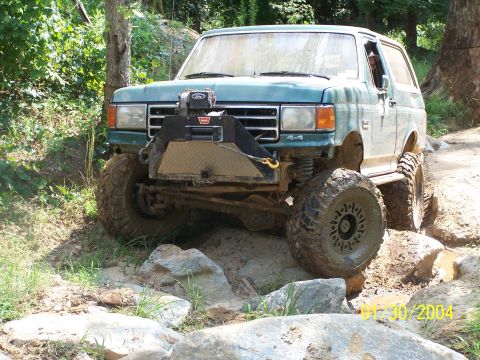 1979 Ford F-150 - This Ford Bronco is navigating a rocky trail, its off-road capabilities.