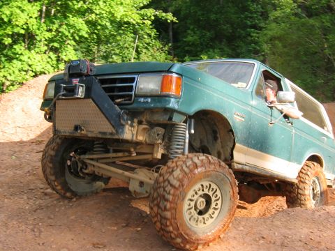 1992 Ford Mustang - This modified green SUV is equipped for off-road adventures with a winch and oversized tires.