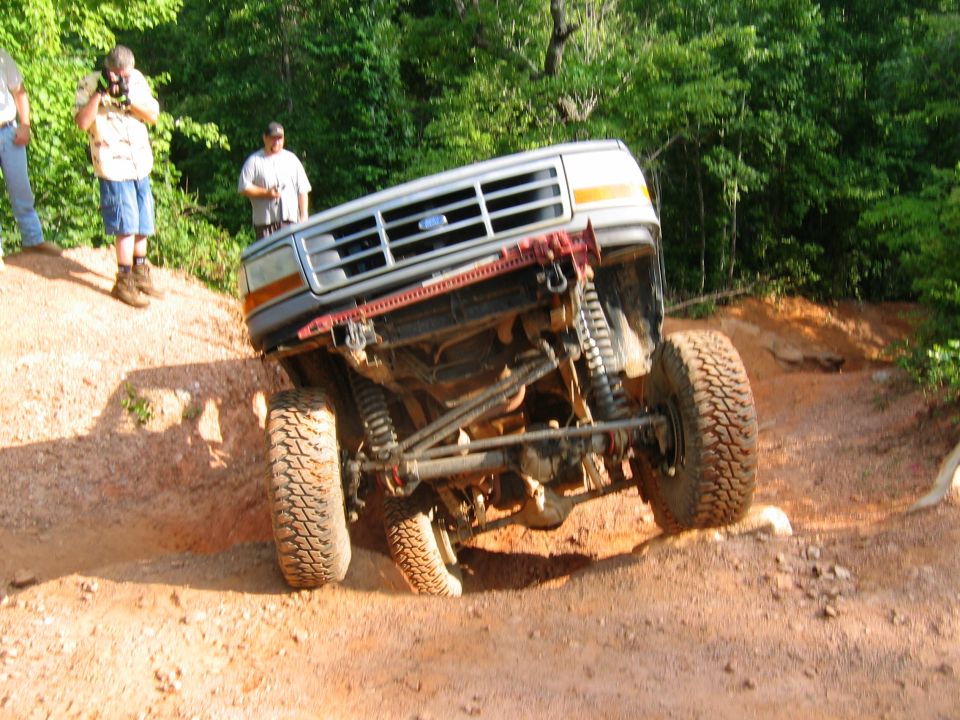 Silver Ford Bronco off-roading, front 3/4 view