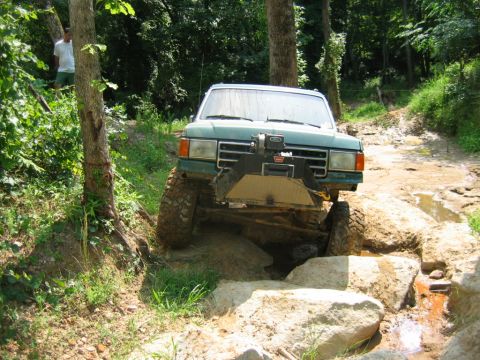 1992 Ford Mustang - This vehicle is equipped for off-road adventures, tackling a challenging rocky terrain.
