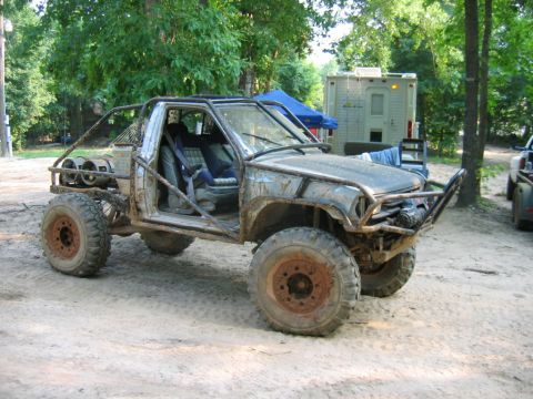 1992 Ford Mustang - This heavily modified buggy features a custom roll cage and oversized tires, suggesting it's built for extreme off-road use.