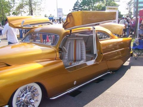 1998 Ford Taurus - This custom coupe features suicide doors and a unique interior, with its hood and trunk open.