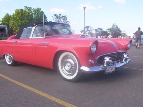 1998 Ford Taurus - This classic red convertible has a distinctive grille and chrome accents.