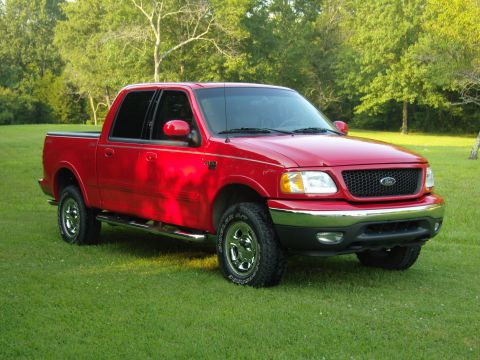2007 Ford Mustang - Photograph of a red Ford pickup truck outdoors, not a technical document.