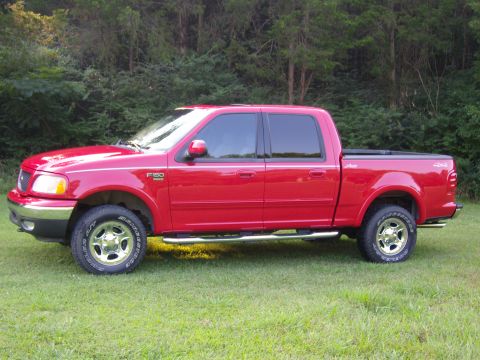 2007 Ford Mustang - Photograph of a red Ford pickup truck side profile, not a technical document.
