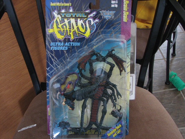 Packaged "Brain Drain" action figure from Todd McFarlane's "Total Chaos" line.