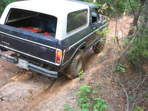 1978 Ford Bronco - 1978 Ford Bronco navigating a challenging off-road trail.