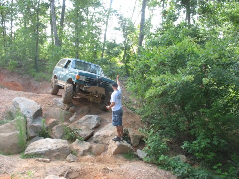 1978 Ford Bronco - A Ford Bronco tackles a challenging off-road course, demonstrating its capabilities on rough terrain.
