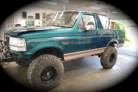 1996 Ford Bronco - This 1996 Ford Bronco is undergoing body repair in a garage setting.