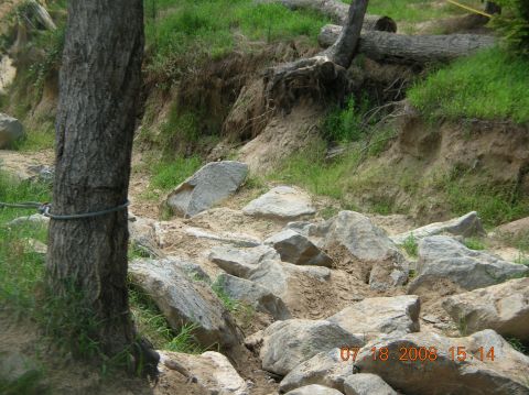 1991 Ford F-150 - A rocky off-road trail with trees and dirt banks, dated 07.18.2008.