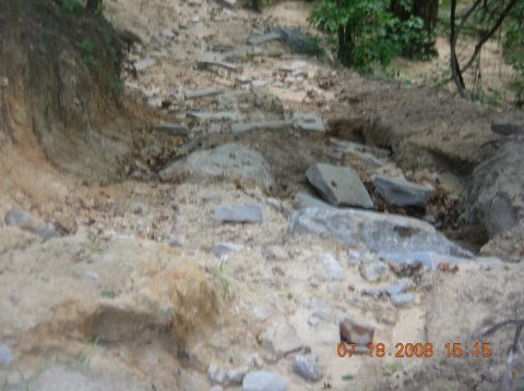 1991 Ford F-150 - The image depicts a , off-road scene with scattered rocks and dirt, a timestamp from 2008.