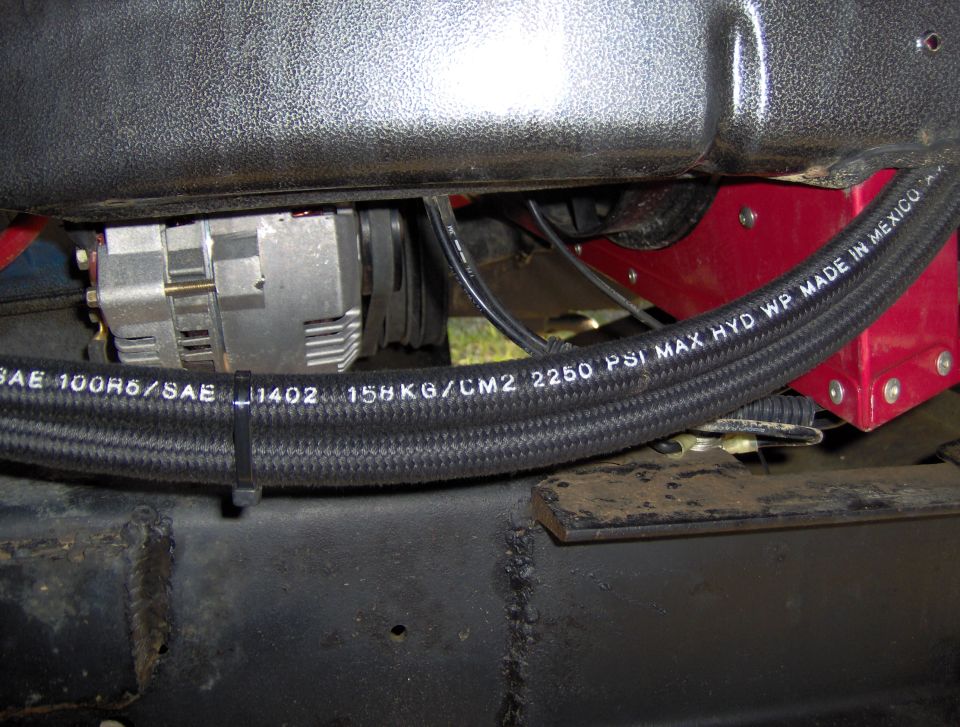 Alternator and braided hose with SAE 100R6/SAE J1402 markings