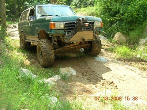 1991 Ford F-150 - This 1991 Ford Bronco navigates a challenging muddy off-road course.