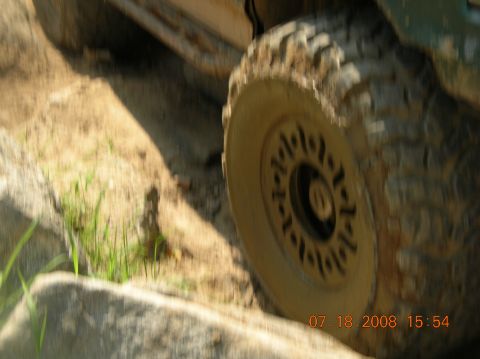 1991 Ford F-150 - Off-road tire navigating rocky terrain, timestamped 07.18.2008.