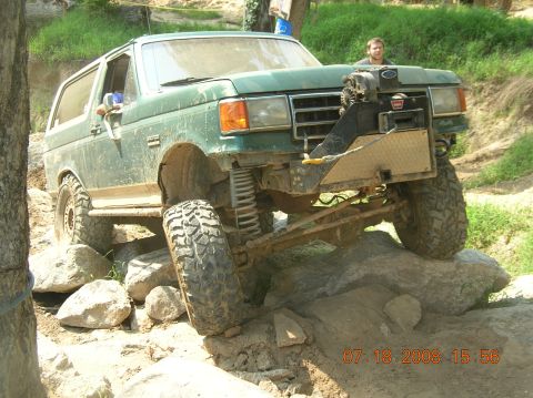 1991 Ford F-150 - This 1991 Ford Bronco is navigating a challenging rocky terrain.