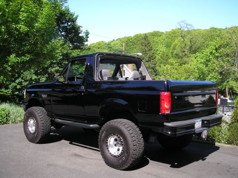 1995 Ford Bronco - This 1995 Ford Bronco features a removable top and is equipped with off-road tires and suspension.