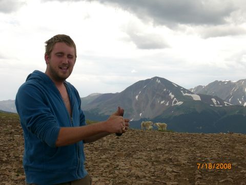 2004 Ford F-150 - Man on mountain summit with goats and scenic view, dated 7/18/2008.