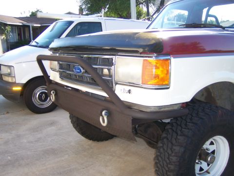 1991 Ford Bronco - Custom front bumper on a 1991 Ford Bronco with a maroon and white two-tone paint scheme.
