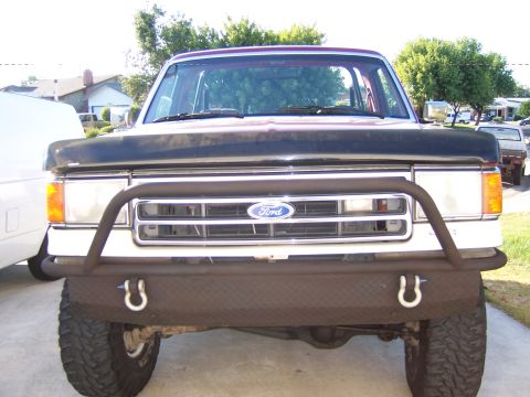 1991 Ford Bronco - Front view of a 1991 Ford Bronco, modified with a custom bumper and brush guard.