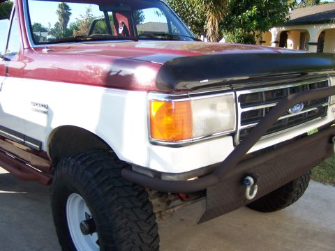 1991 Ford Bronco - This 1991 Ford Bronco features a custom front bumper and brush guard, complementing its two-tone paint scheme.
