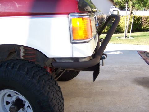 1991 Ford Bronco - This photo shows the front corner of a modified pickup truck with a heavy-duty aftermarket bumper.