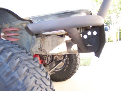 1991 Ford Bronco - Close-up view of a custom fabricated front bumper and suspension components on an off-road vehicle.