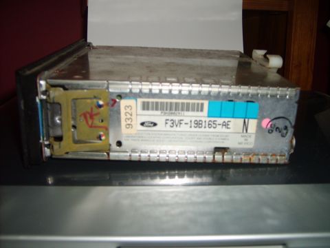 1993 Ford Crown Victoria - The rear view of a car stereo unit with a label showing "F3VF-19B165-AE" and "MADE IN MEXICO".