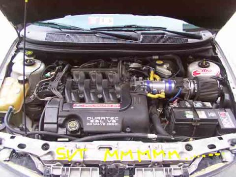 1998 Ford Taurus - The engine compartment shows a Duratec V6 engine with modifications to the air intake system.