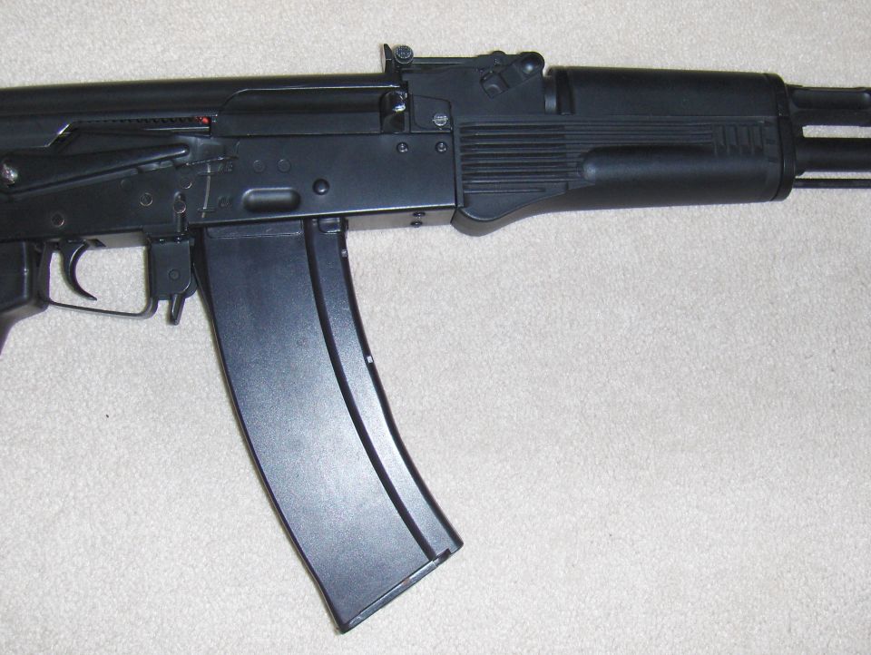 Airsoft rifle with a large capacity magazine attached