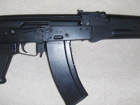 2003 Ford Crown Victoria - This is a close-up view of an airsoft rifle, focusing on its mechanical components.