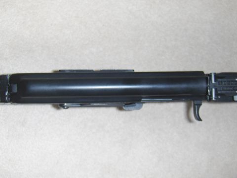 2003 Ford Crown Victoria - A close-up view of a firearm receiver, showing the trigger and other components.
