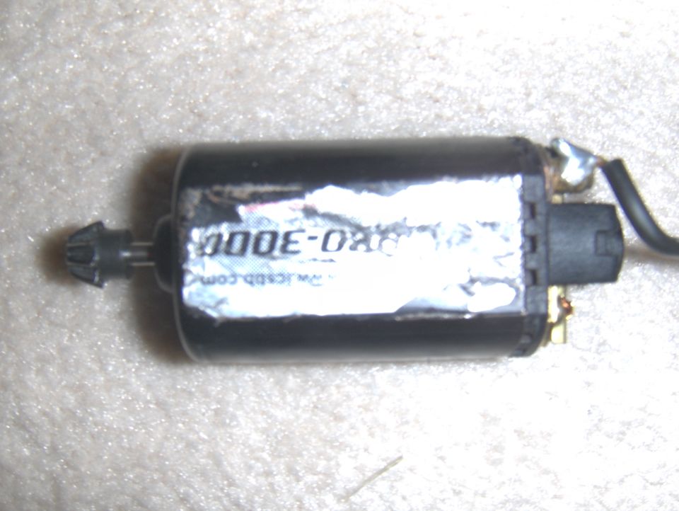 Black electric motor with a label reading "000E-080" and "www.jcbb.com", attached wires