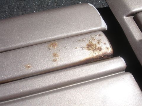 1993 Ford Taurus - This close-up shows sections of car trim with visible rust and damage.