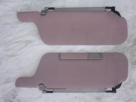 1993 Ford Taurus - Pair of car sun visors shown on a white cloth background.