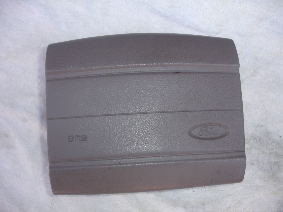 Ford airbag cover with SRS text and Ford oval logo