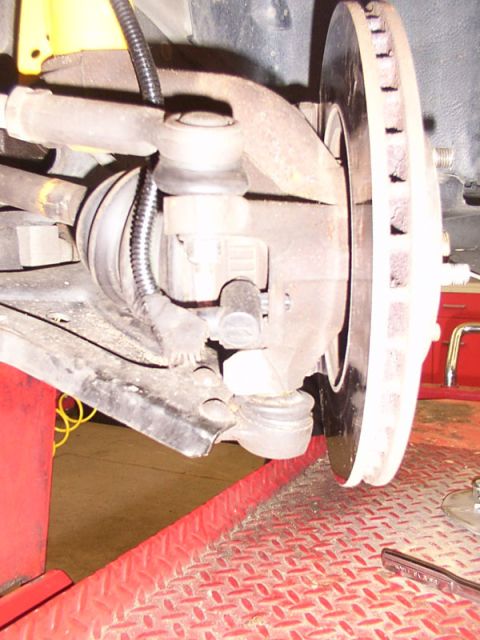 1998 Ford Taurus - Front suspension components and brake rotor shown in detail.