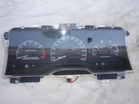 1993 Ford Taurus - This instrument cluster features a speedometer, tachometer, fuel gauge, and temperature gauge, with various indicator lights below.