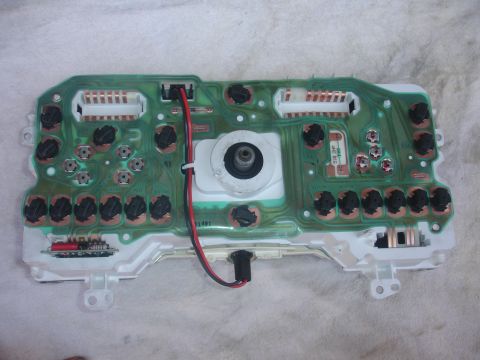1993 Ford Taurus - Back view of an automotive instrument cluster circuit board, showing connectors and electronic components.
