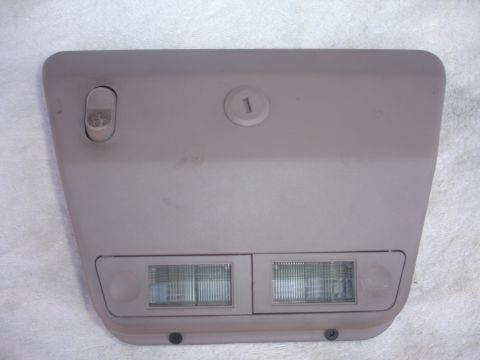 1993 Ford Taurus - Tan overhead console part with two lights and a switch, marked with a '1'.