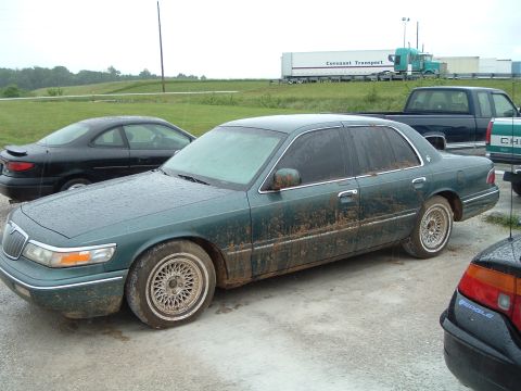 1995 Mercury Grand Marquis - This 1995 Mercury Grand Marquis is seen covered in mud, suggesting it has been driven off-road.