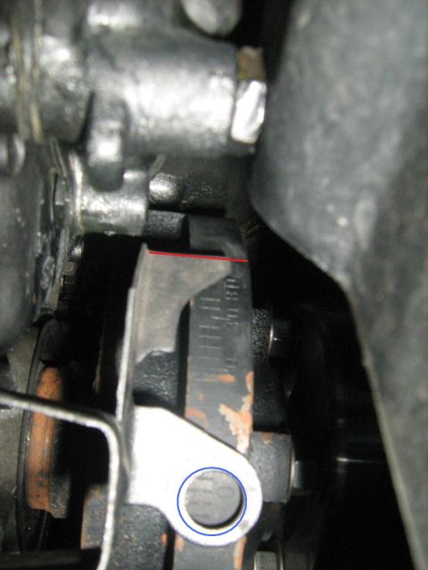1988 Mercury Grand Marquis - Close-up of an engine component with measurement markings and a circular hole.